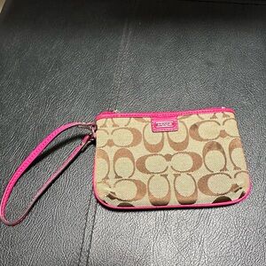 Coach wristlet. Tan with fushia interior.
